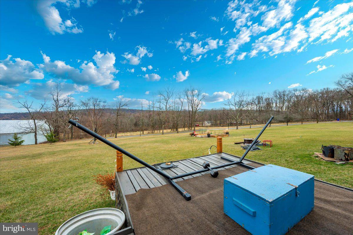 14231 Ridenour Road Smithsburg, MD 21783 - Photo 62 of 76 a view of a swimming pool with a patio and a yard