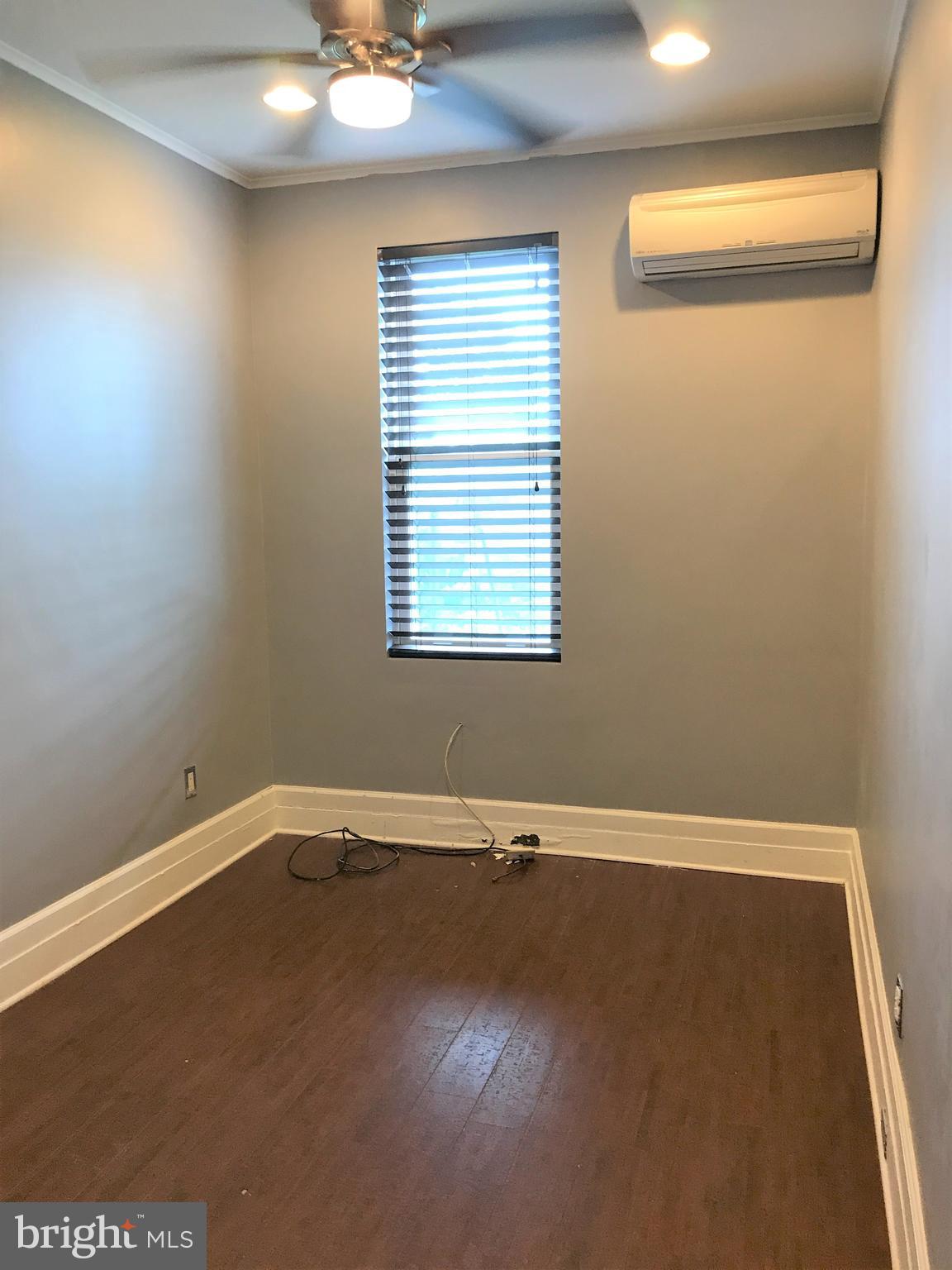 1609 Bolton Street Baltimore, MD 21217 - Photo 13 of 16 an empty room with a window