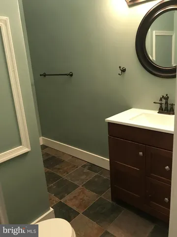 a bathroom with a toilet and a sink