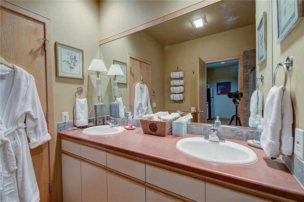 2027 Soda Ridge Road, Unit 1934 Keystone, CO 80435 - Photo 11 of 21 a bathroom with double vanity sink and a mirror