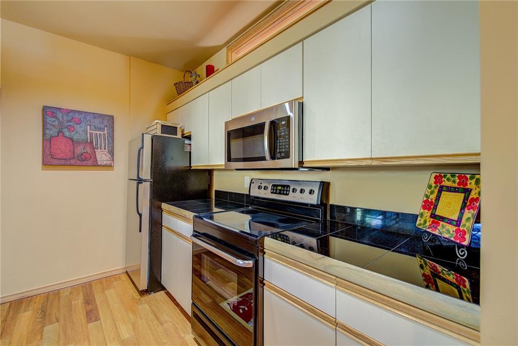 2027 Soda Ridge Road, Unit 1934 Keystone, CO 80435 - Photo 13 of 21 a kitchen with stainless steel appliances a stove microwave and a refrigerator