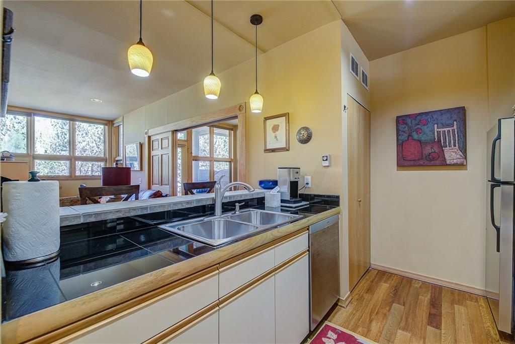 2027 Soda Ridge Road, Unit 1934 Keystone, CO 80435 - Photo 14 of 21 a kitchen with sink and view of living room