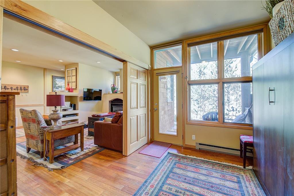 2027 Soda Ridge Road, Unit 1934 Keystone, CO 80435 - Photo 16 of 21 a living room with furniture windows and wooden floor