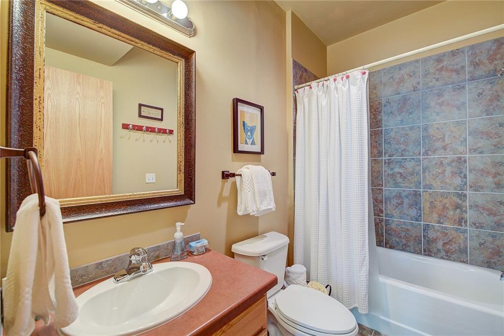 2027 Soda Ridge Road, Unit 1934 Keystone, CO 80435 - Photo 18 of 21 a bathroom with a sink toilet and shower