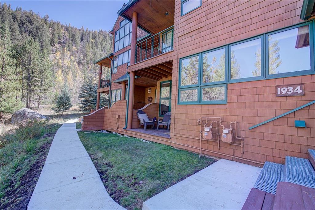 2027 Soda Ridge Road, Unit 1934 Keystone, CO 80435 - Photo 3 of 21 a view of a brick house with a yard