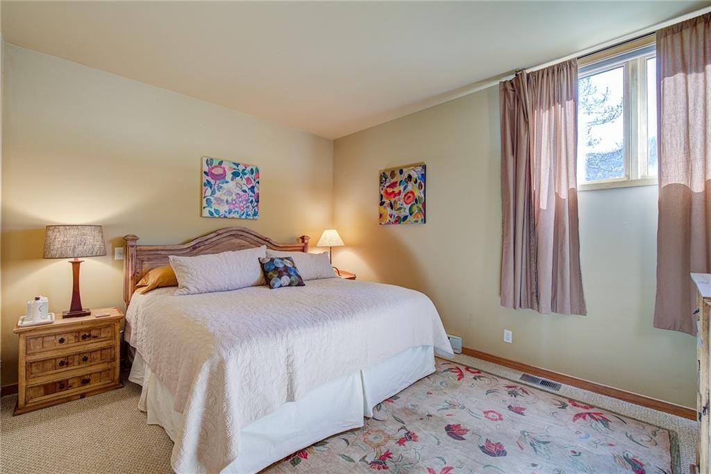 2027 Soda Ridge Road, Unit 1934 Keystone, CO 80435 - Photo 9 of 21 a bedroom with a bed and a window