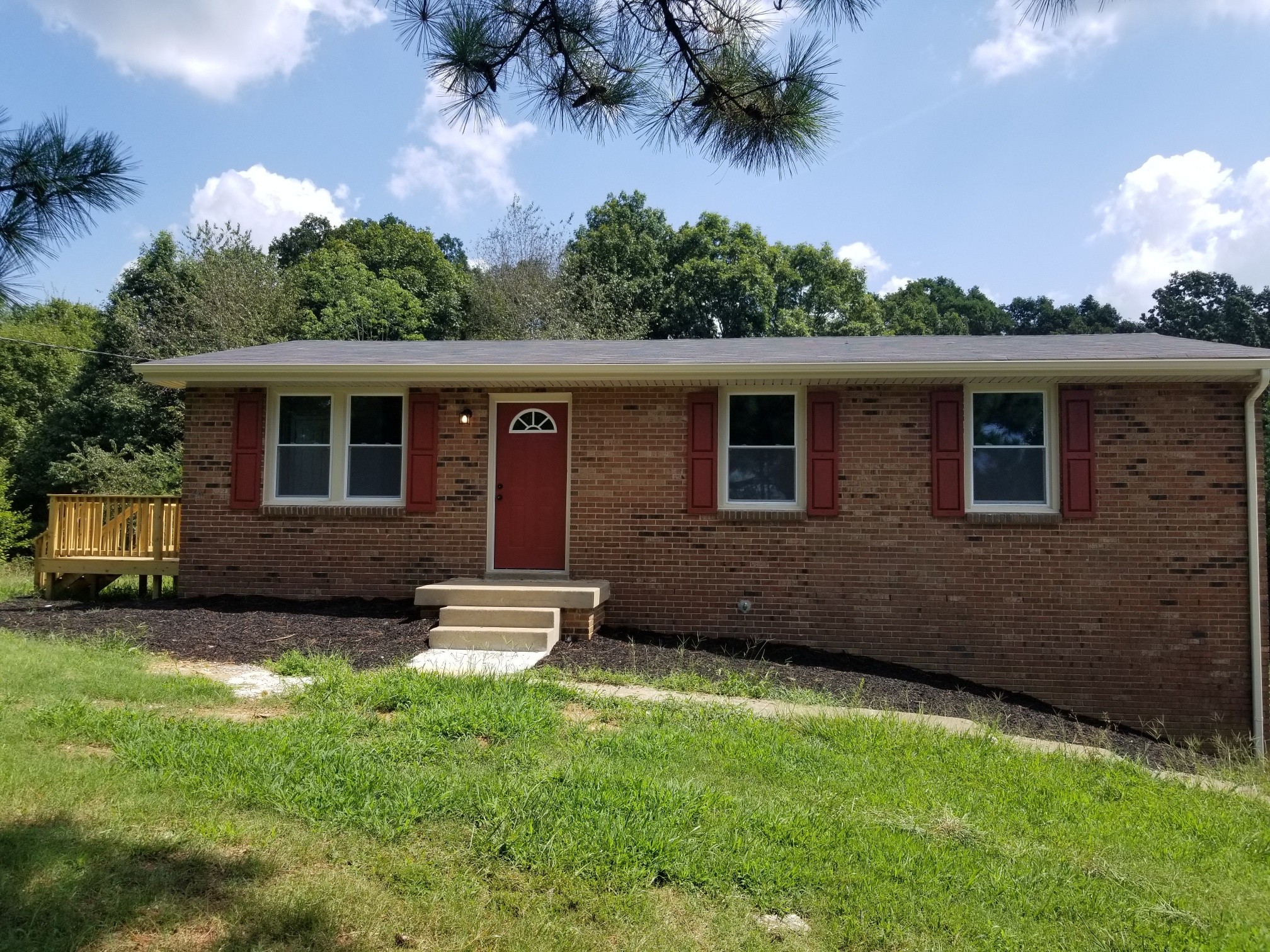 4440 Old Metal Road Palmyra, TN 37142 - Photo 1 of 21 a front view of a house with a yard