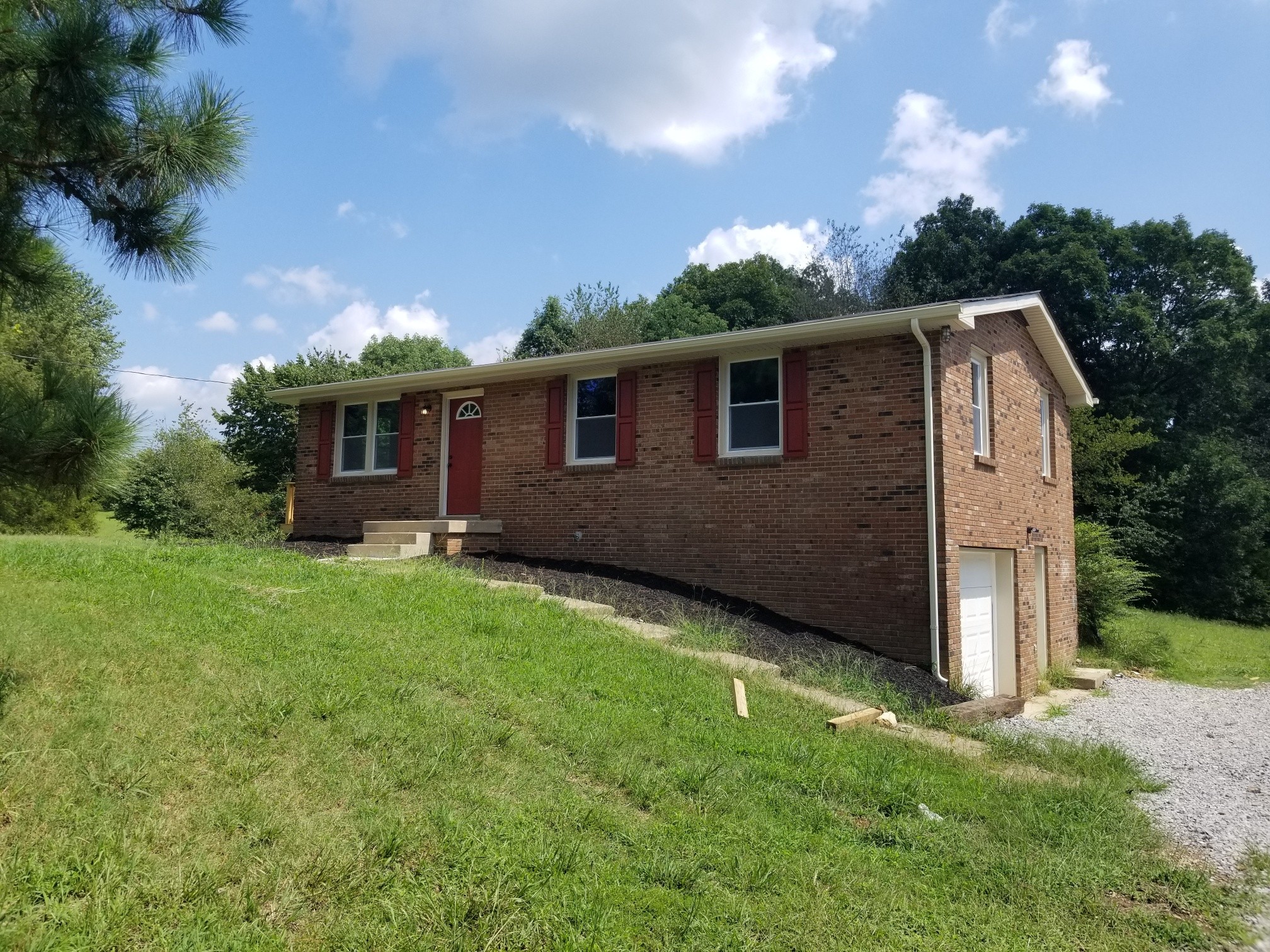 4440 Old Metal Road Palmyra, TN 37142 - Photo 2 of 21 a front view of house with yard and green space
