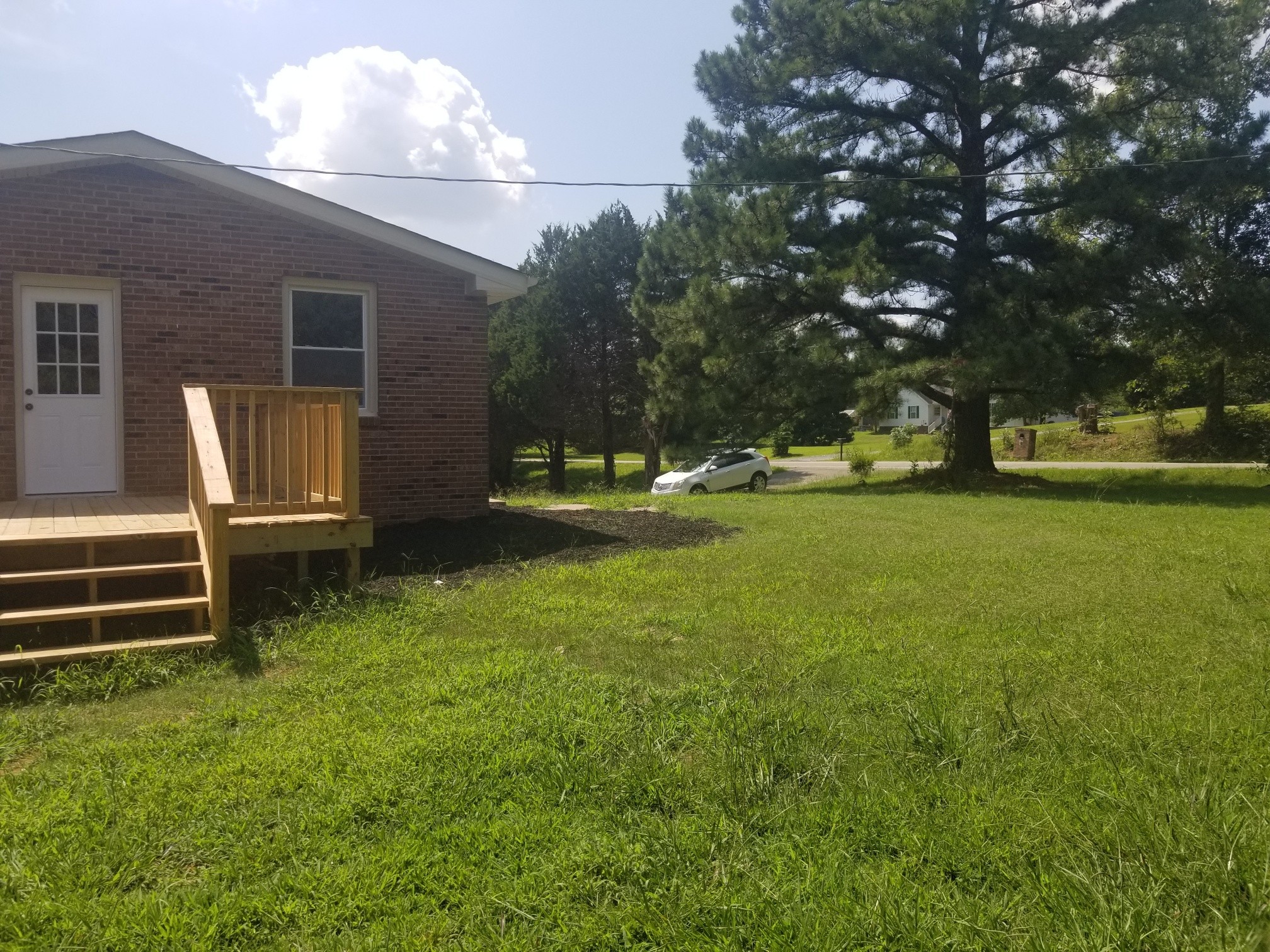 4440 Old Metal Road Palmyra, TN 37142 - Photo 11 of 21 a view of a house with backyard and garden