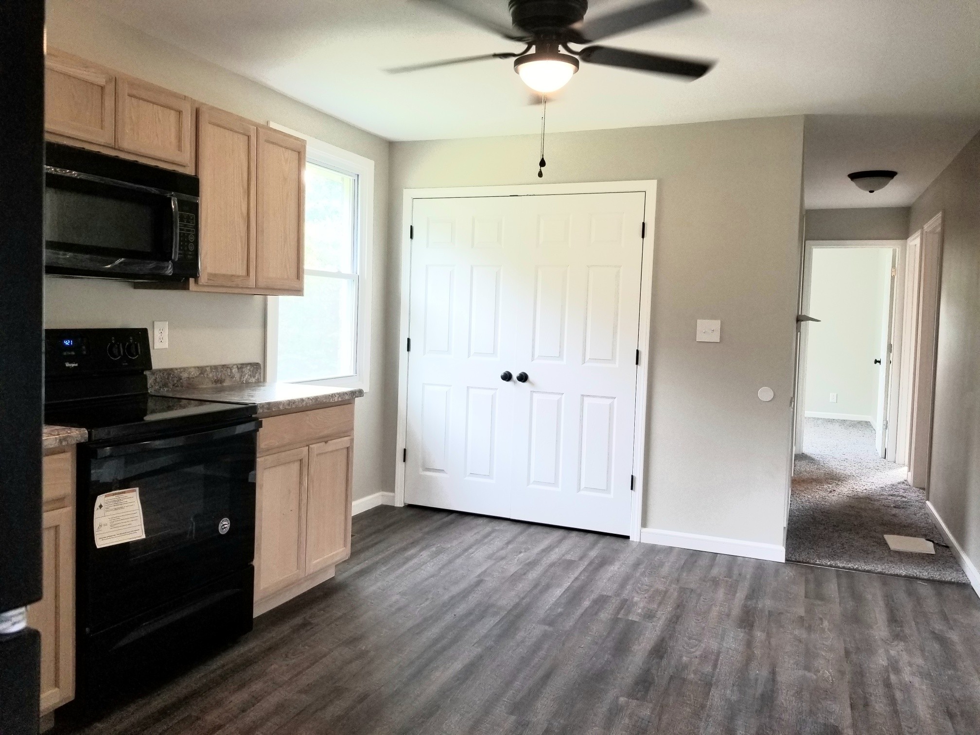 4440 Old Metal Road Palmyra, TN 37142 - Photo 12 of 21 a kitchen with stainless steel appliances granite countertop a stove a refrigerator and a microwave oven