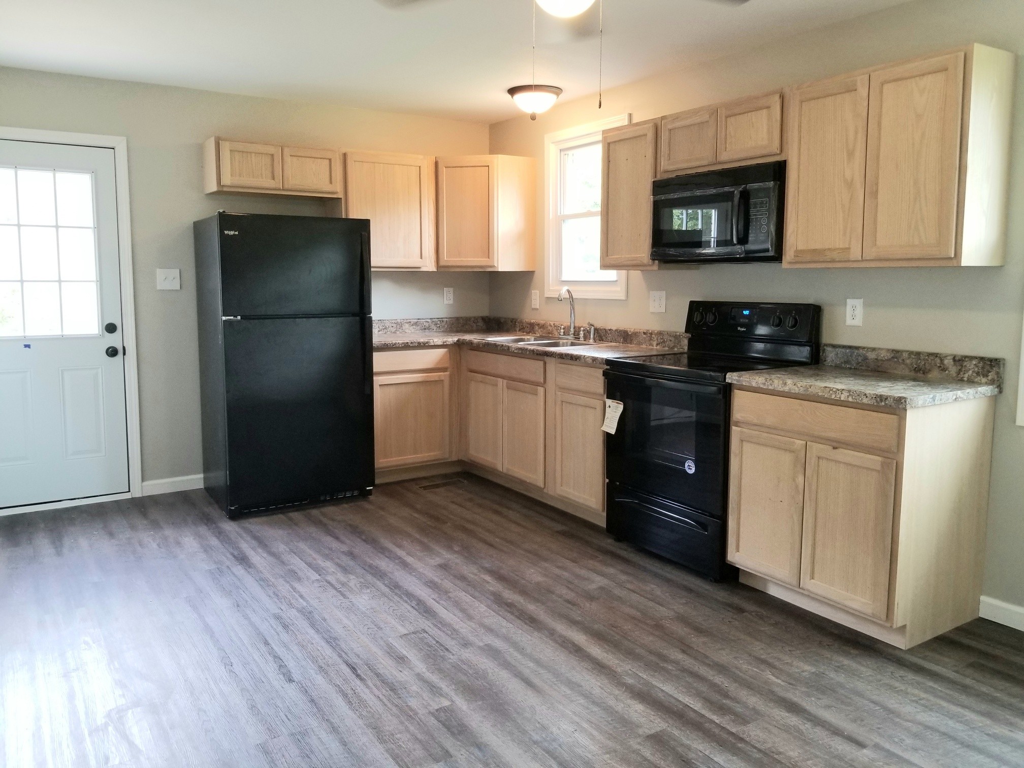 4440 Old Metal Road Palmyra, TN 37142 - Photo 6 of 21 a kitchen with a refrigerator stove top oven and sink