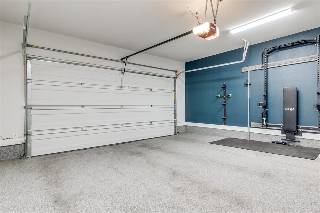 1119 Lavender Ridge Dallas, TX 75204 - Photo 20 of 24 Large two car garage with collapsable workout equipment for tenant's enjoyment!