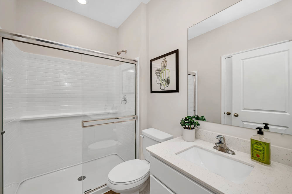 266 Snowdrop Lane Elgin, IL 60124 - Photo 12 of 25 a bathroom with a sink toilet and shower