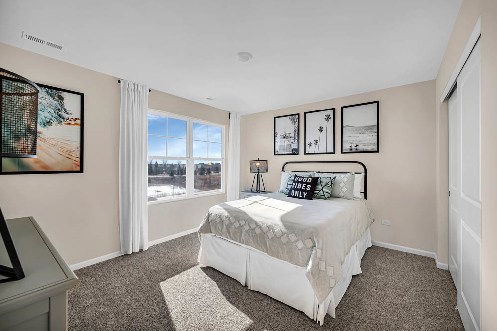 266 Snowdrop Lane Elgin, IL 60124 - Photo 18 of 25 a bedroom with a large bed and a window