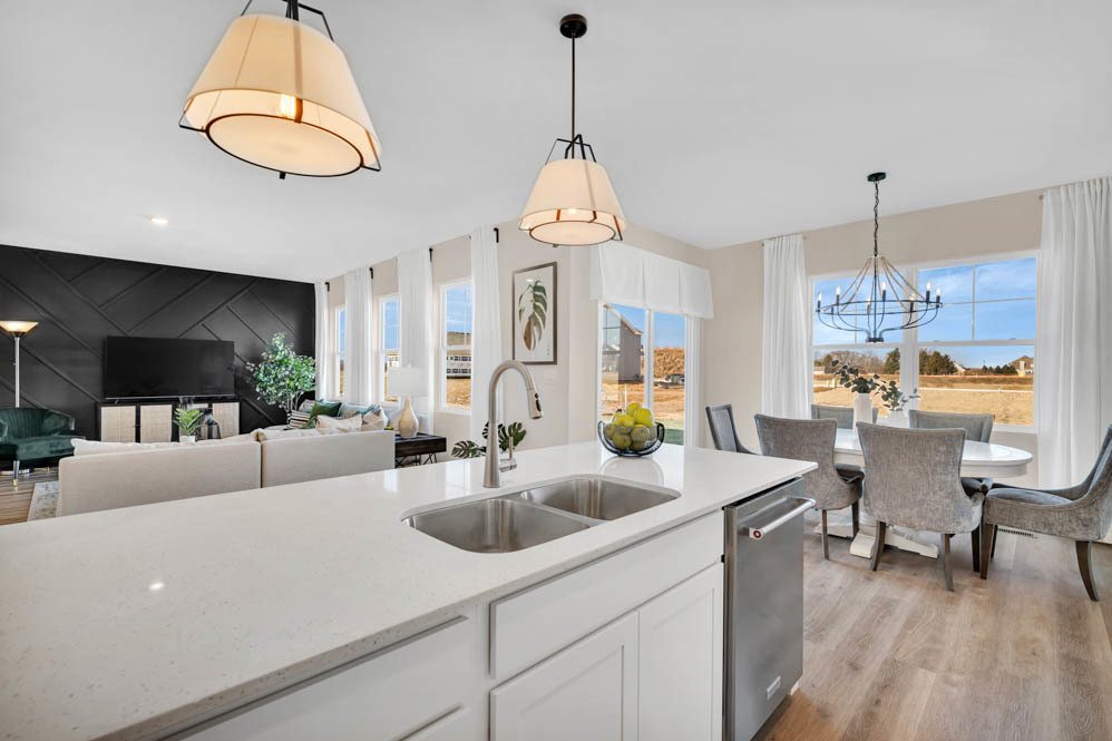 266 Snowdrop Lane Elgin, IL 60124 - Photo 7 of 25 a living room with kitchen island furniture and a chandelier