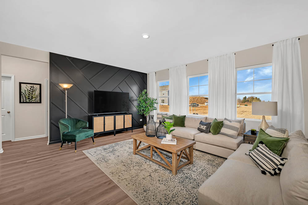 266 Snowdrop Lane Elgin, IL 60124 - Photo 9 of 25 a living room with furniture and a flat screen tv