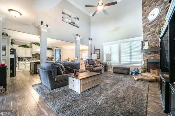 a kitchen with stainless steel appliances granite countertop a stove and more cabinets