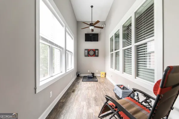wooden floor in an empty room with a window