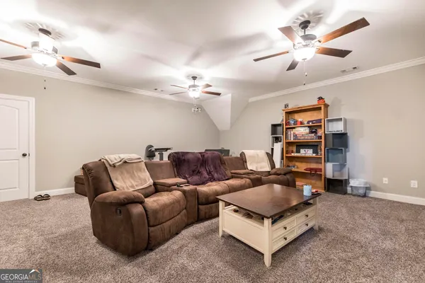 a view of two chairs in the balcony
