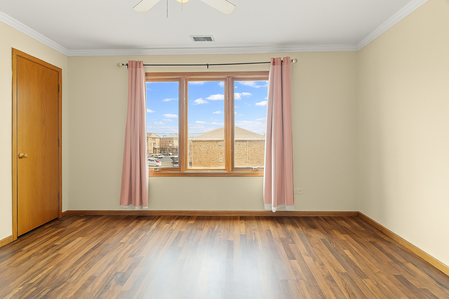 10710 Central Avenue, Unit 3D Chicago Ridge, IL 60415 - Photo 14 of 24 an empty room with wooden floor and windows