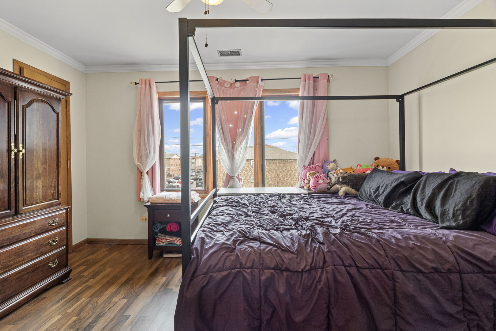 10710 Central Avenue, Unit 3D Chicago Ridge, IL 60415 - Photo 15 of 24 a bed sitting in a bedroom next to a window