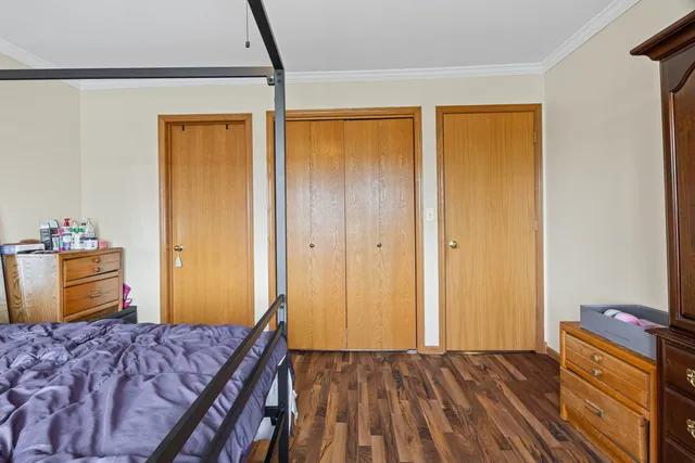 a bedroom with a bed and a dresser