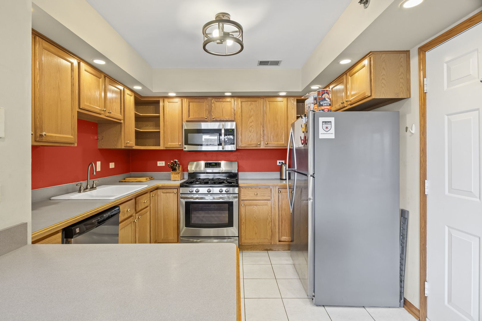 10710 Central Avenue, Unit 3D Chicago Ridge, IL 60415 - Photo 3 of 24 a kitchen with stainless steel appliances granite countertop a refrigerator and a stove