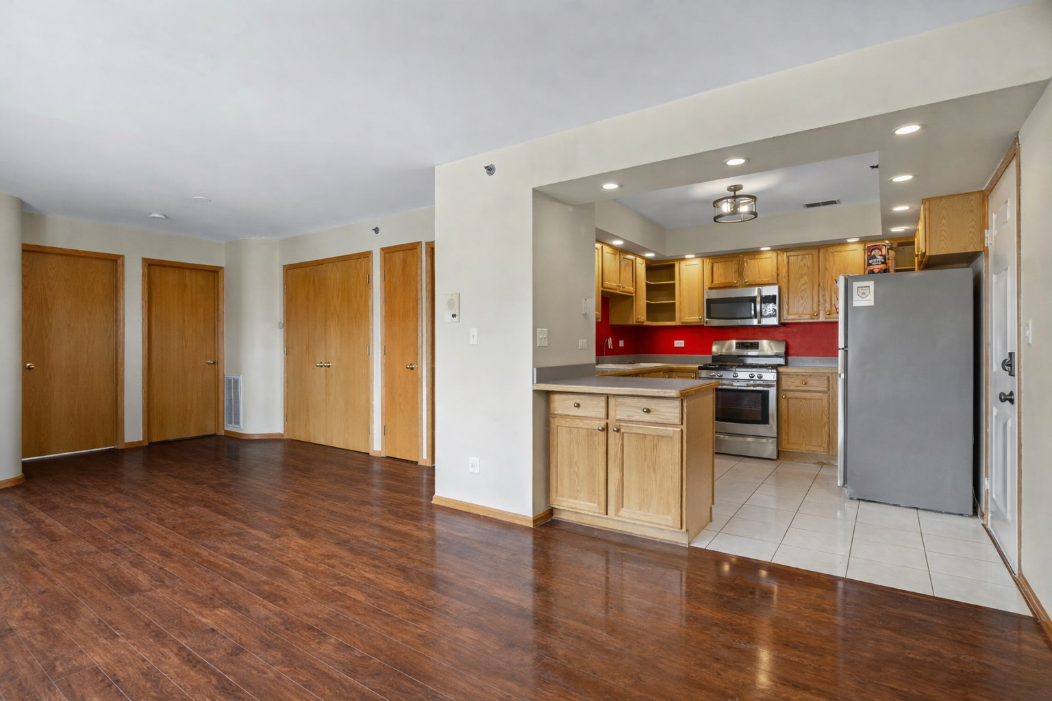 10710 Central Avenue, Unit 3D Chicago Ridge, IL 60415 - Photo 6 of 24 a kitchen with stainless steel appliances a refrigerator and a stove top oven