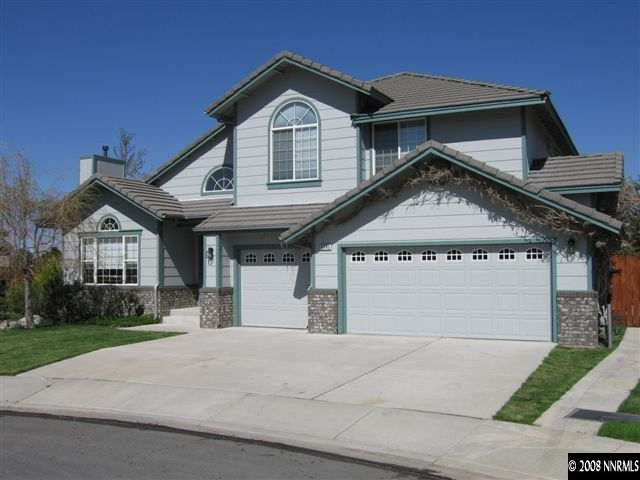 6540 Fieldbrook Circle Reno, NV 89519 - Photo 1 of 1 a front view of a house with a yard and garage