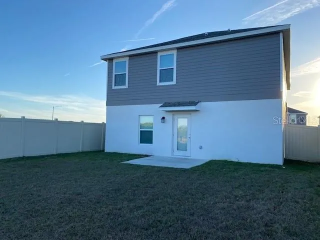 a view of backyard of house