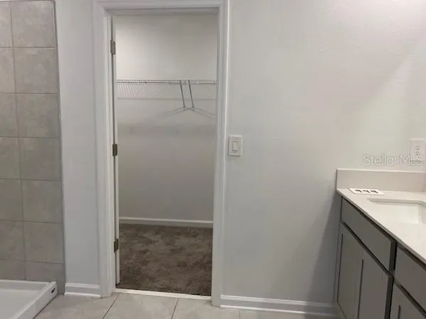 a bathroom with a sink and vanity