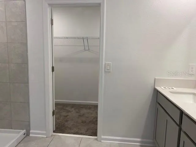 a bathroom with a sink and vanity