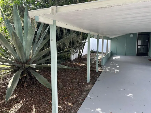 a view of a porch with furniture