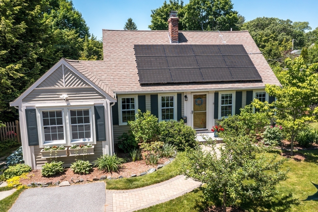 16 Beverly Road Natick, MA 01760 - Photo 1 of 37 a front view of a house with a yard and potted plants