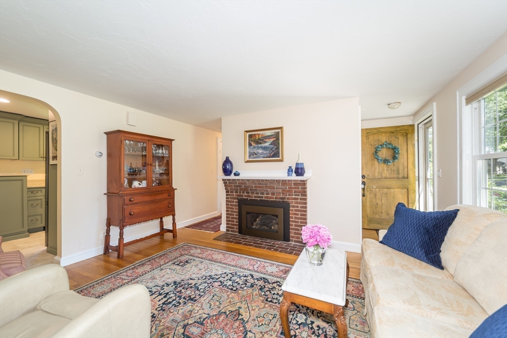 16 Beverly Road Natick, MA 01760 - Photo 11 of 37 a living room with furniture and a fireplace