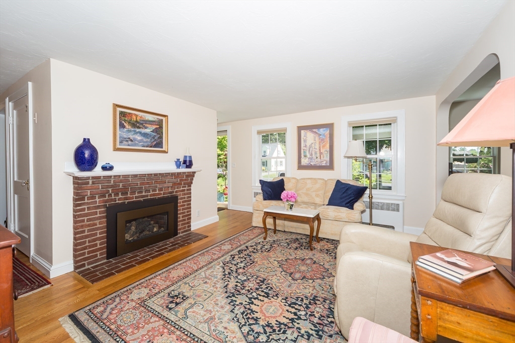 16 Beverly Road Natick, MA 01760 - Photo 12 of 37 a living room with furniture and a fireplace