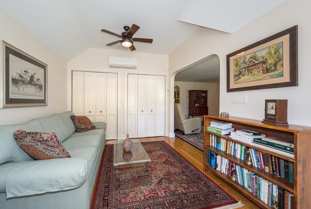16 Beverly Road Natick, MA 01760 - Photo 15 of 37 a living room with furniture or couch and a bookshelf