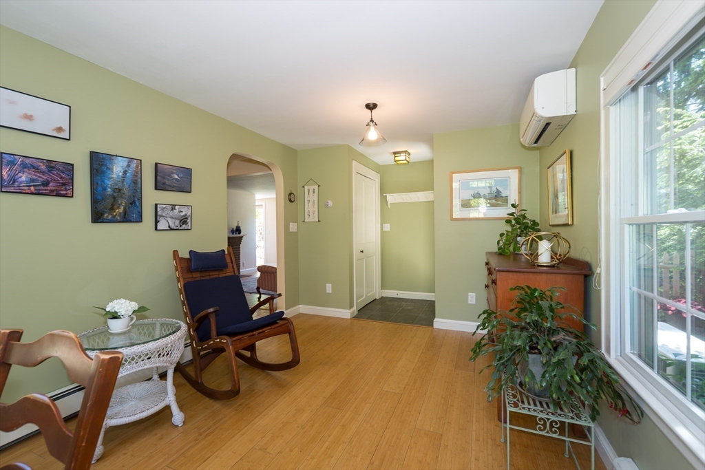16 Beverly Road Natick, MA 01760 - Photo 17 of 37 a living room with furniture a window and a potted plant