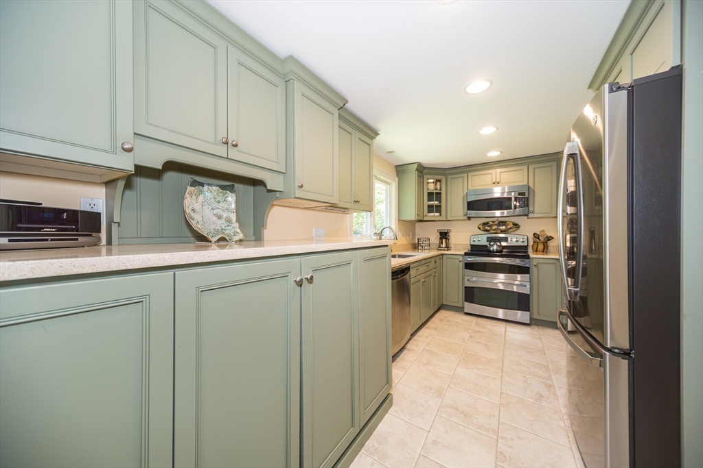 16 Beverly Road Natick, MA 01760 - Photo 19 of 37 a kitchen with a refrigerator sink and cabinets