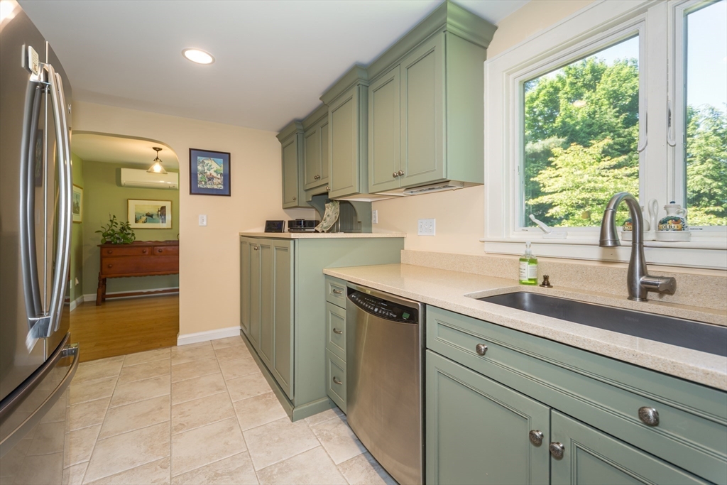 16 Beverly Road Natick, MA 01760 - Photo 21 of 37 a kitchen with a sink and a refrigerator