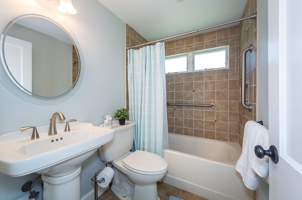 16 Beverly Road Natick, MA 01760 - Photo 22 of 37 a bathroom with a sink toilet and shower
