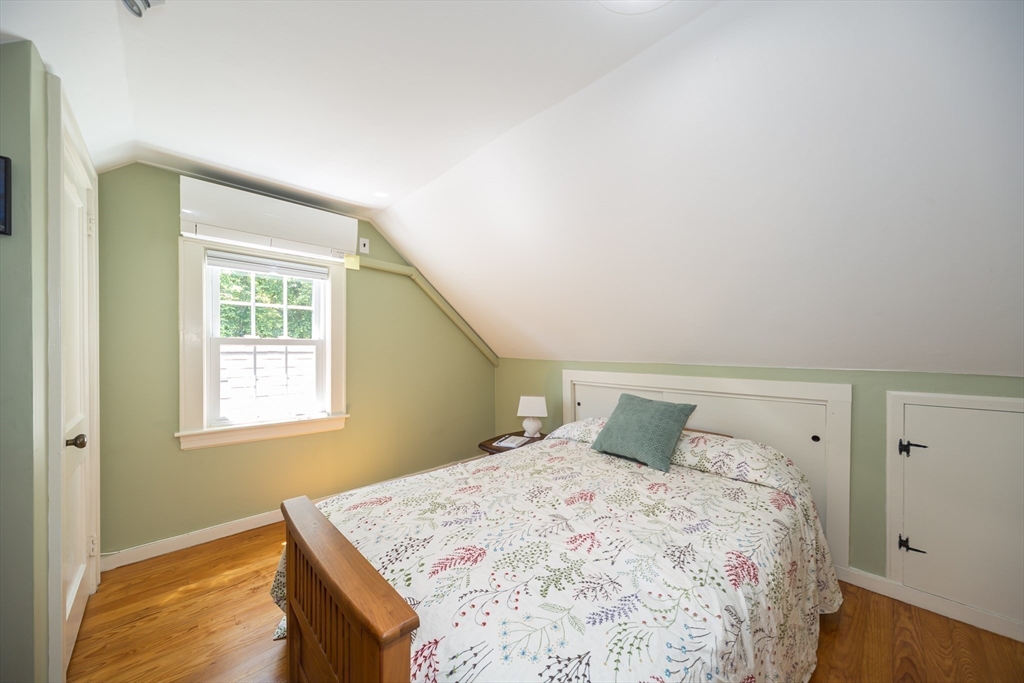 16 Beverly Road Natick, MA 01760 - Photo 28 of 37 a bedroom with a bed and wooden floor