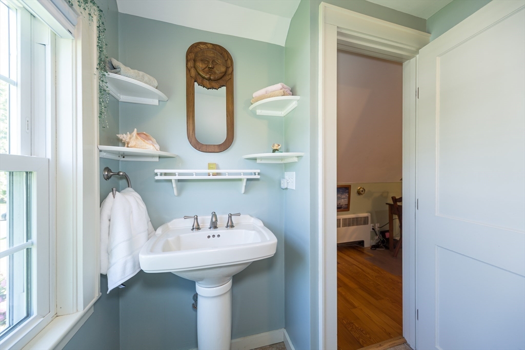 16 Beverly Road Natick, MA 01760 - Photo 30 of 37 a bathroom with a sink and a mirror