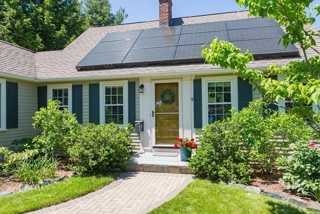 16 Beverly Road Natick, MA 01760 - Photo 3 of 37 a front view of a house with garden
