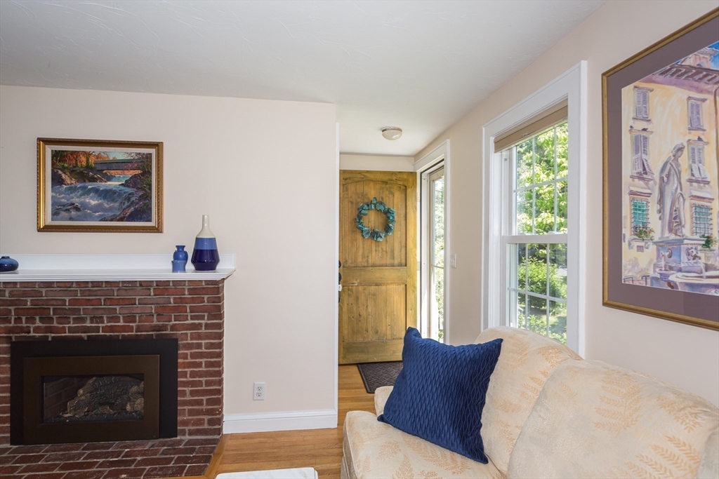 16 Beverly Road Natick, MA 01760 - Photo 10 of 37 a living room with furniture and a fireplace