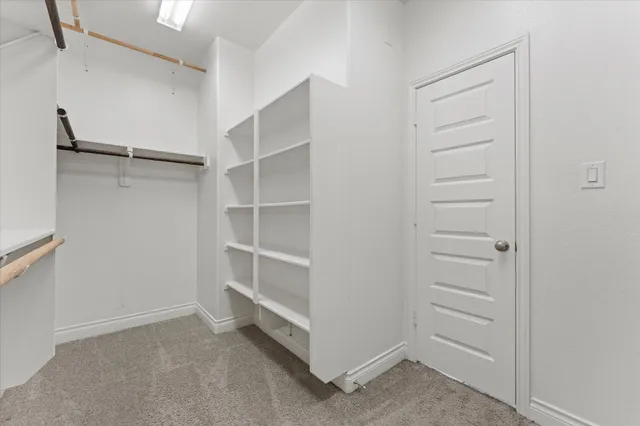 a view of an empty walk in closet