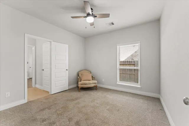 a view of livingroom with furniture and chandelier fan