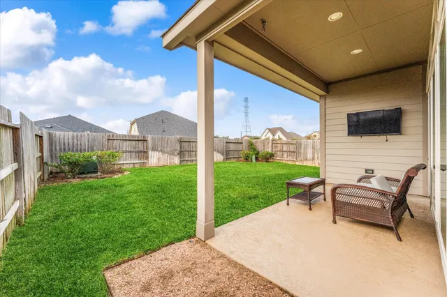 a view of a house with backyard porch and garden