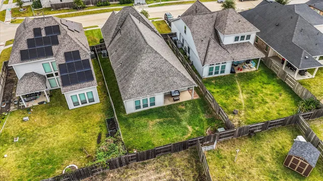 an aerial view of a house with swimming pool