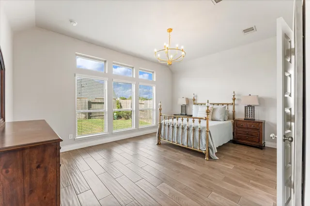 a bed room with a bed and a window